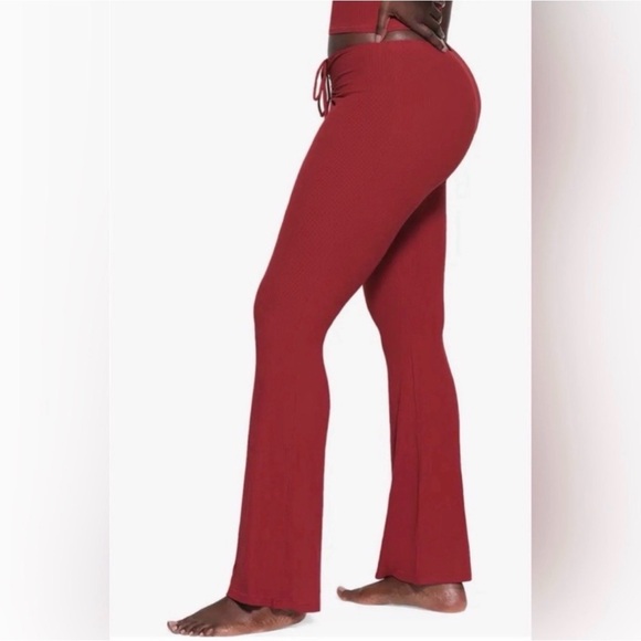SKIMS Ribbed Drawstring Boot-Cut Pants in Deep Red - Picture 2 of 9